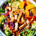Craving a light, refreshing summer meal? Dive into my Asian Sesame Chicken Salad recipe that transforms ordinary ingredients into a flavor explosion you'll love. Learn how!
