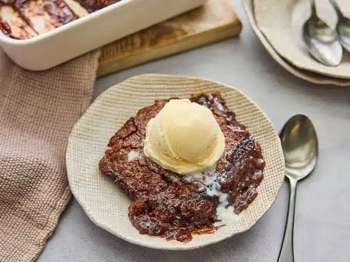 Delicious Chocolate Cobbler dessert served warm with vanilla ice cream