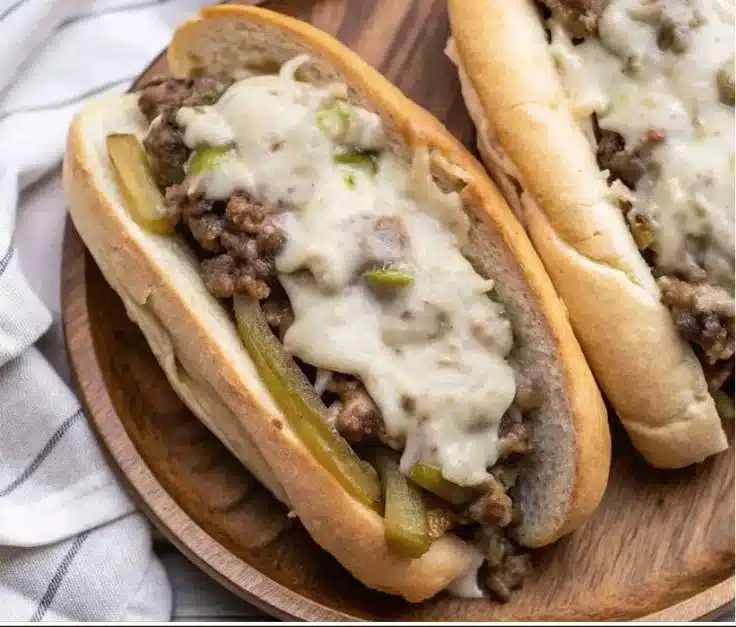 Ground Beef Philly Cheesesteaks 3 Delicious Ground Beef Philly Cheesesteaks served with melted cheese and peppers