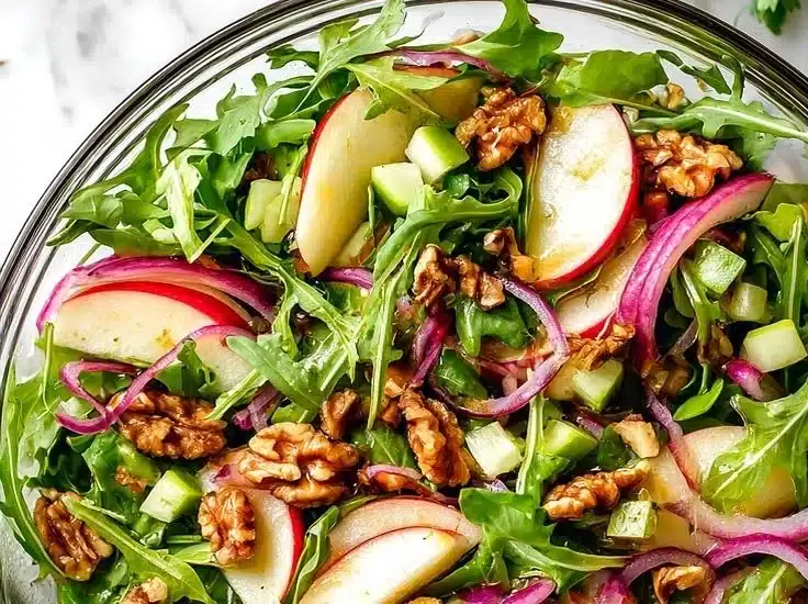 Fresh celery apple salad with crunchy ingredients and dressing