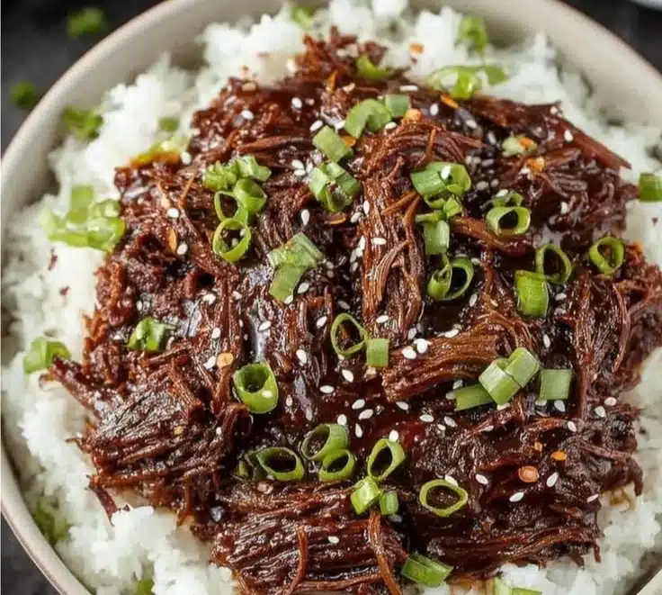 Tender slow cooker Korean beef served with rice and vegetables